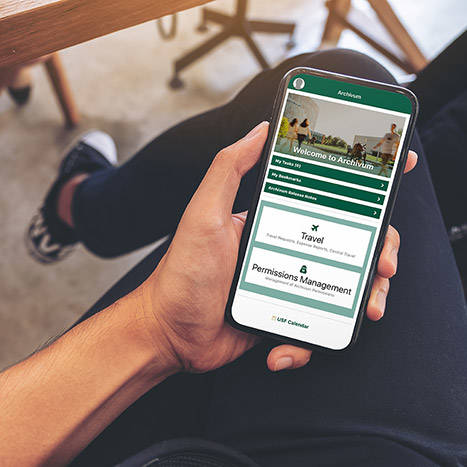 Person holding phone using the Archivum app