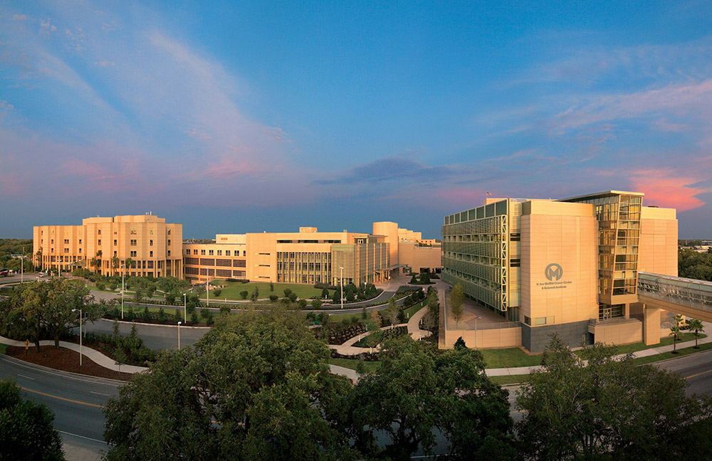 Aerial view of the Moffitt Cancer Center against a blue skyline.